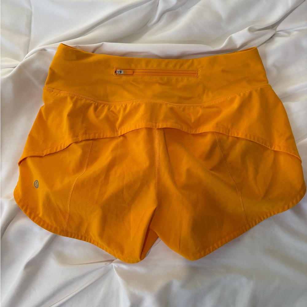 Lululemon Orange Speed Up Shorts size 4 tall 4”